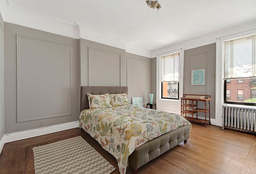 Contemporary Master Bedroom with Crown molding by The Corcoran Group