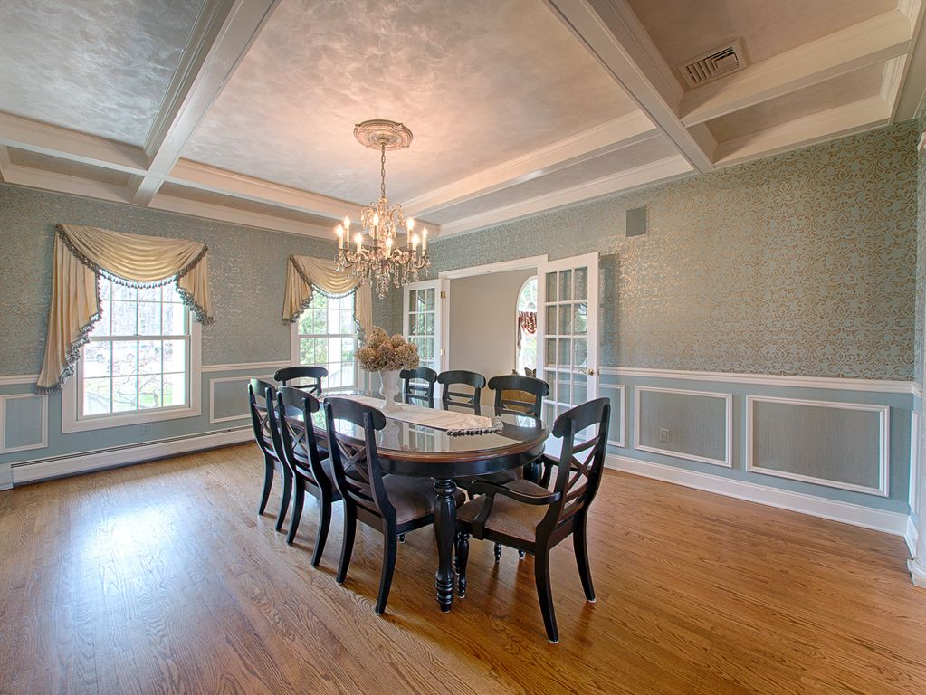 Traditional Dining Room with High ceiling & Wainscoting ...