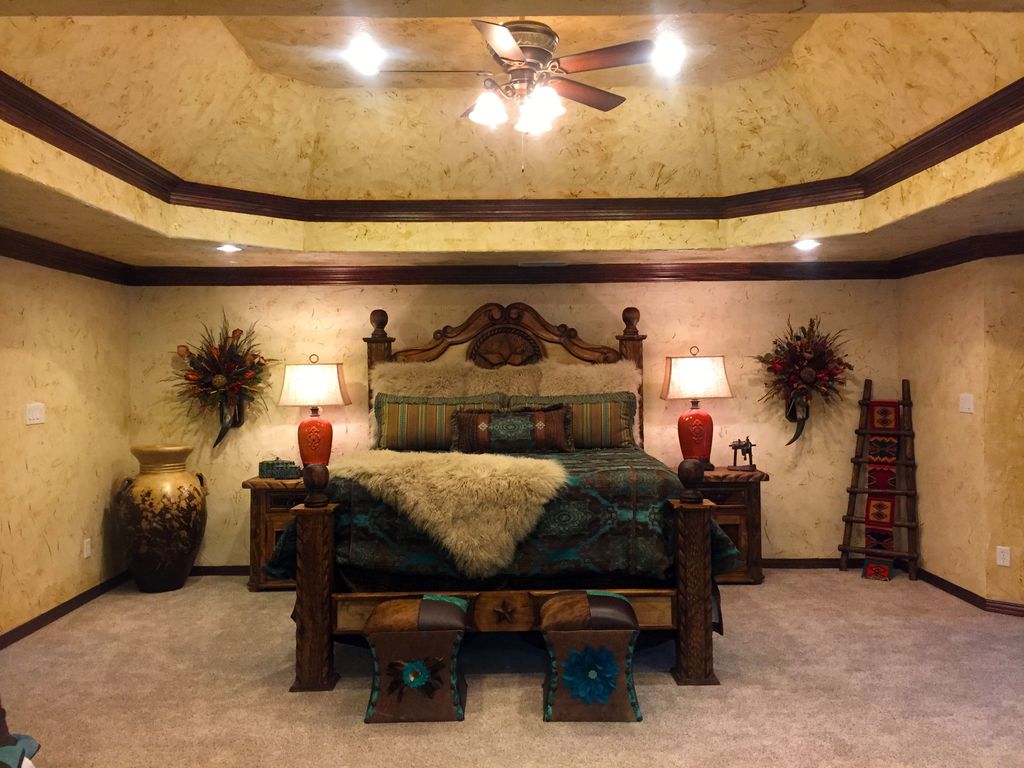  Rustic  Master  Bedroom with Crown molding by Adobe 