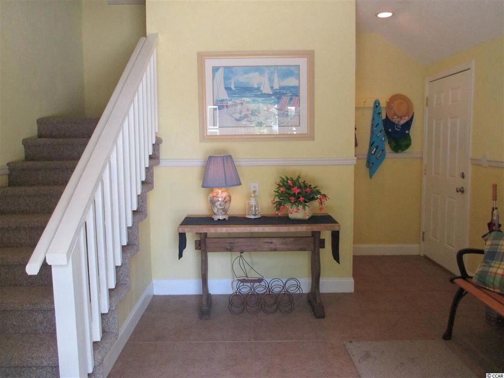 traditional entryway with chair rail & travertine tile floors in traditional entryway with chair rail & travertine tile floors in