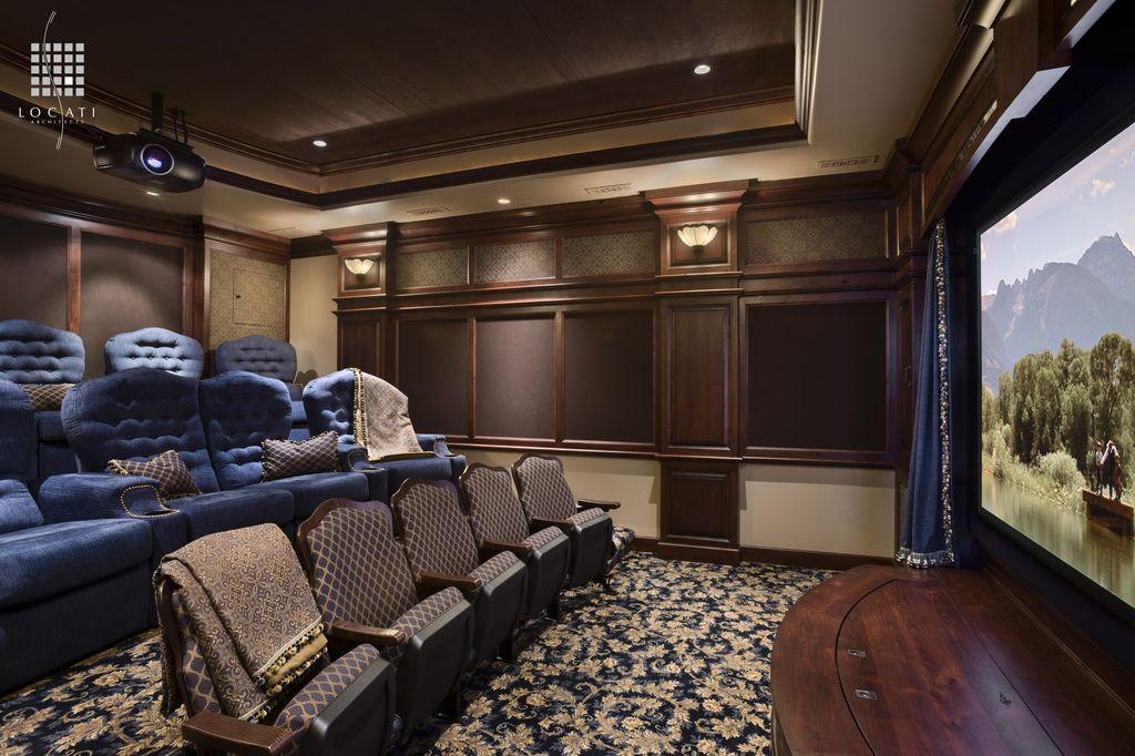 Traditional Home Theater with Crown molding by Locati Architects