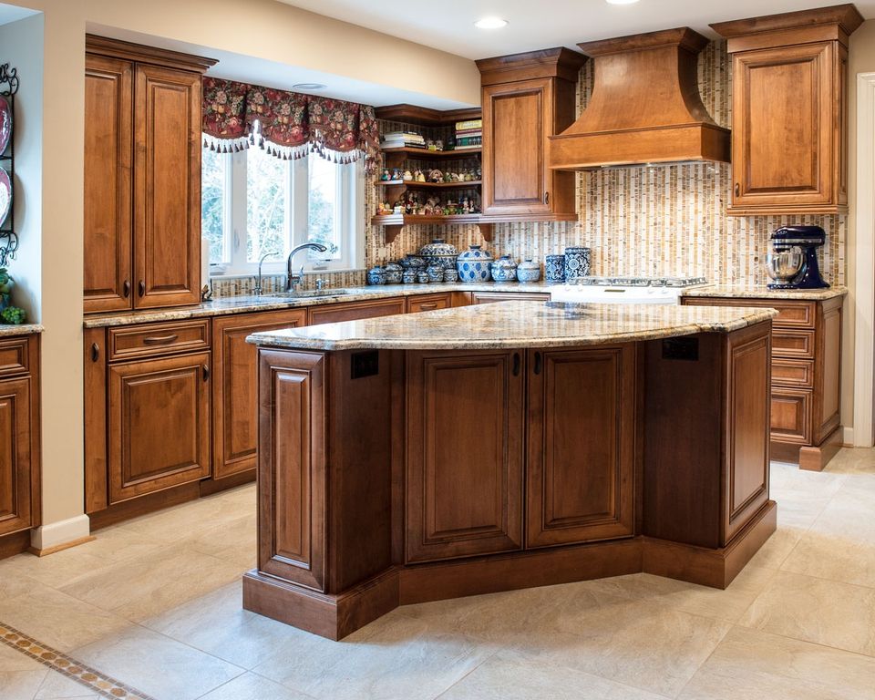 Traditional Kitchen with Simple granite counters by Jan Goldman