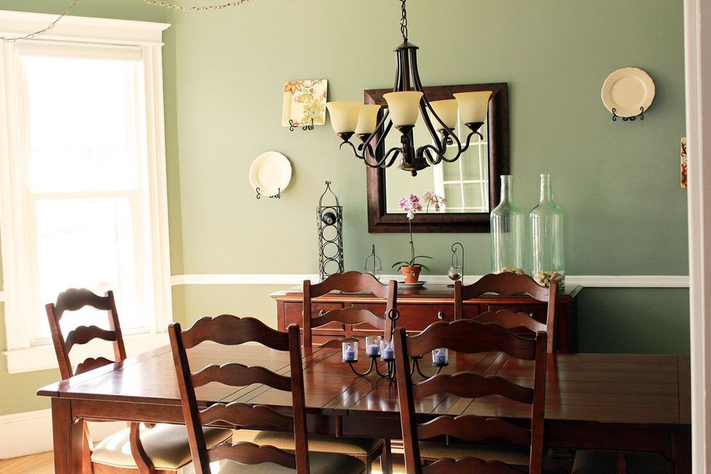 Traditional Dining Room with Chandelier & Chair rail in Oswego, NY