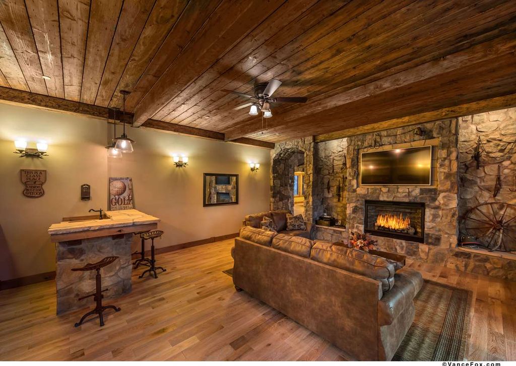 Rustic Great Room with Ceiling fan & Crown molding in Truckee, CA ... - Rustic Great Room with flush light, Ceiling fan, Carpet, Hardwood floors,  Pendant