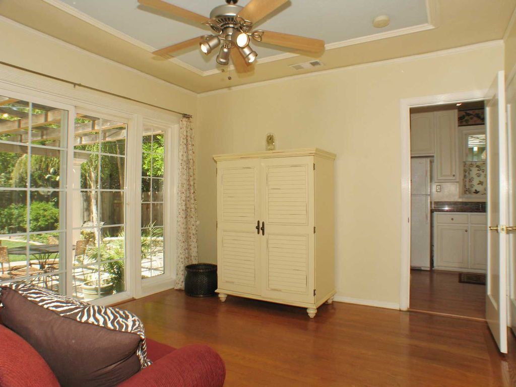 Traditional Living Room With Specialty Door Crown Molding In Traditional Living Room With Hardwood Floors Specialty Door Crown Molding Ceiling Fan