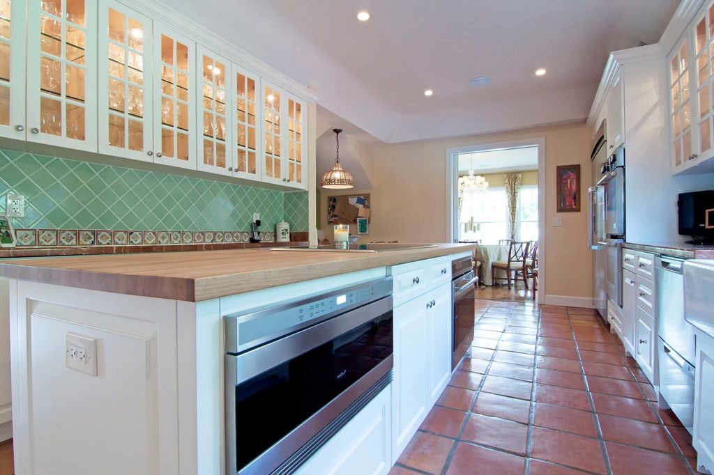 Traditional Kitchen with terracotta tile floors & mexican ...