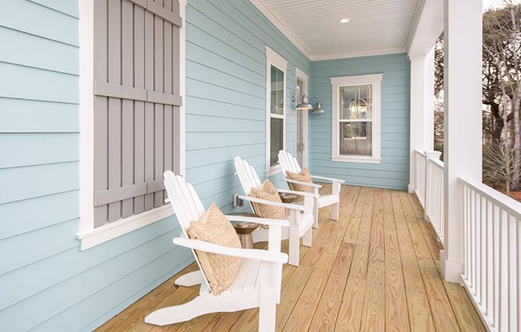 Light blue painted house exterior. Light blue, white and gray color