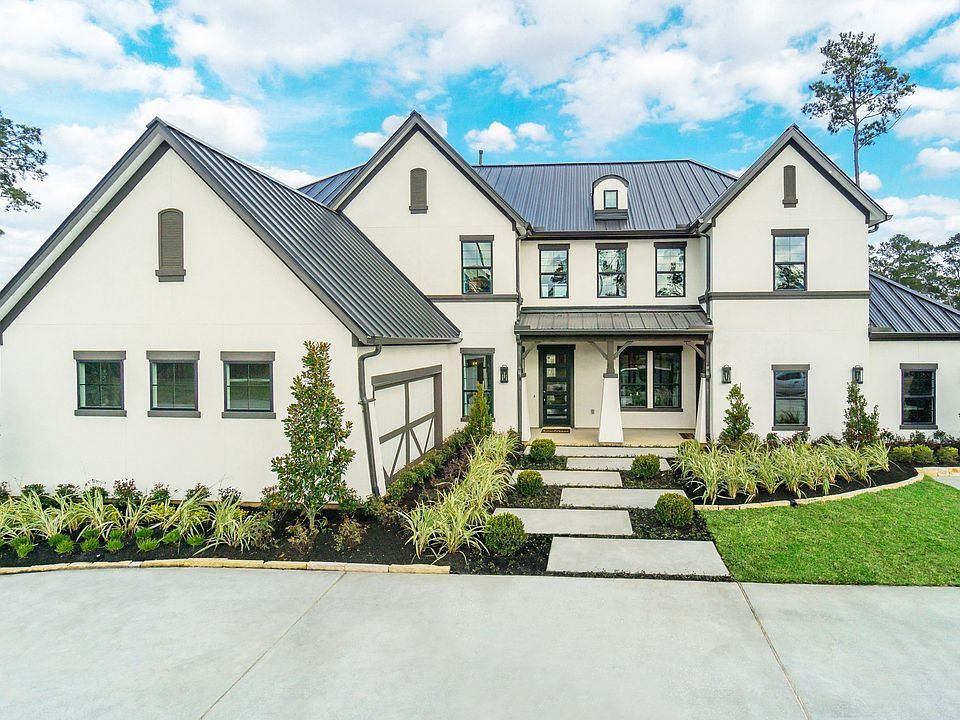 Experience refined living in Mostyn Manor Reserve with sleek white exteriors and a contemporary blac