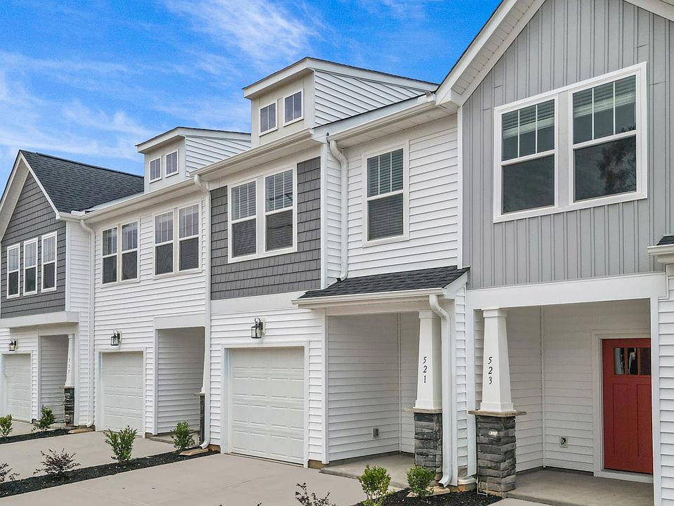 New two story townhomes with two car parking pad one car garage at Hickory Heights by DRB Homes in