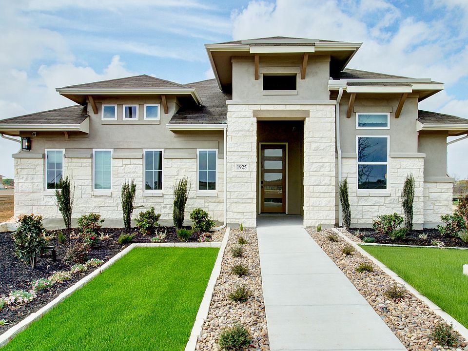 Elegant stone facade and pristine landscaping detail this Veranda community gem.