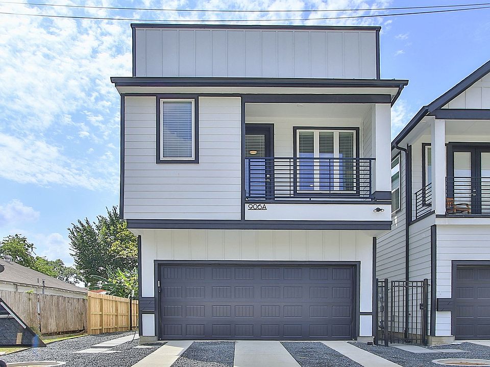 Elegant detached townhome with modern facade and private balcony in Shady Acres, Houston.