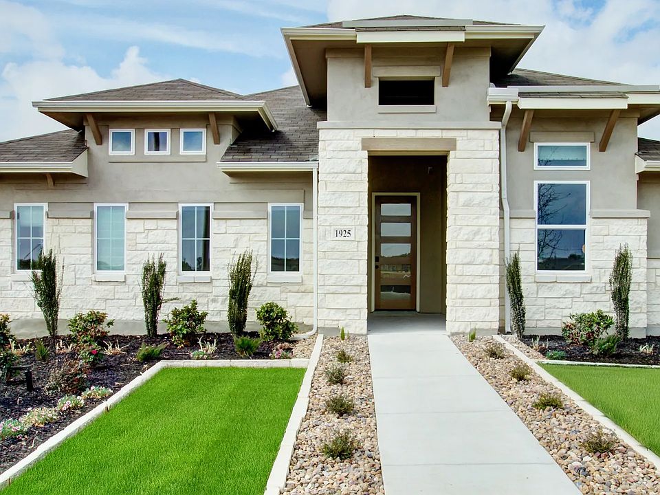 Elegant stone facade and pristine landscaping detail this Veranda community gem.