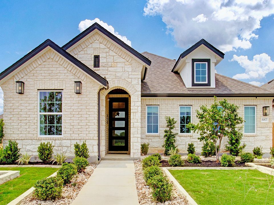This Sunflower Ridge home boasts exquisite brickwork and lush landscaping, ideal for luxury living.