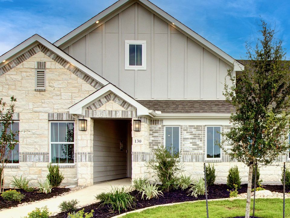 Luxurious stone facade with premium siding and manicured gardens in Westridge, San Antonio.