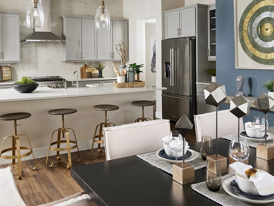 Luxurious kitchen in Trevenna features sleek cabinetry, modern decor, and a chic island design.