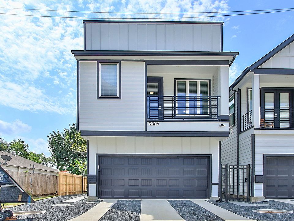 Elegant detached townhome with modern facade and private balcony in Shady Acres, Houston.