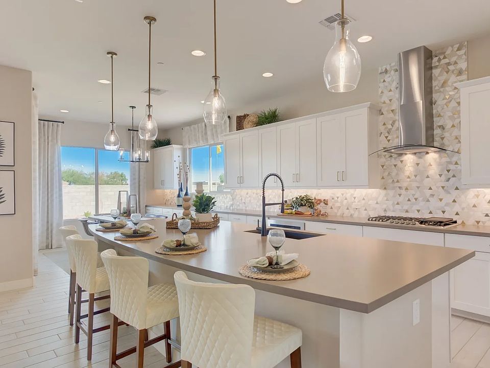 Exquisite kitchen features sleek island, modern pendant lights, and chic geometric backsplash, Palaz