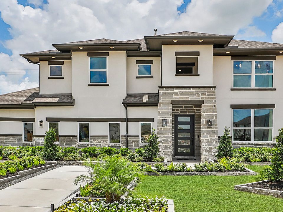 Elegant stone facade and lush gardens enhance this Texas villa in Beamer Villas.