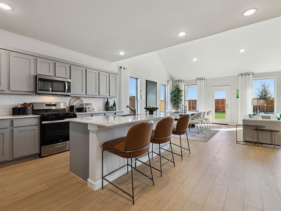 REPRESENTATIVE PHOTO - Kitchen in a Winters model home by Trophy Signature Homes