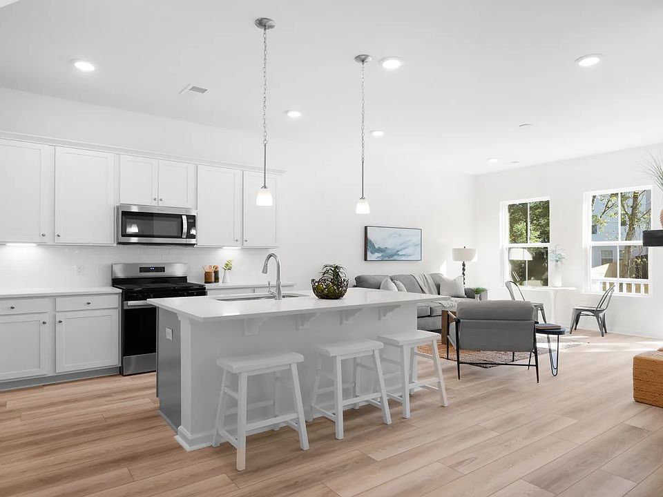 Open concept kitchen in new single-family home off of noisette creek in park circle