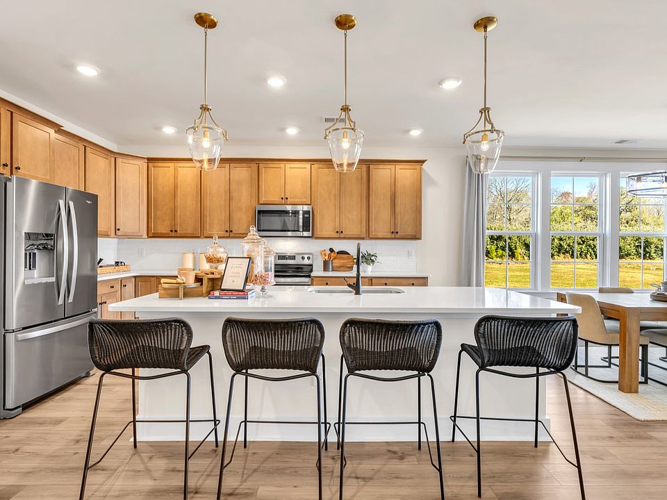 Kitchen in Chestnut Farms in by DRB homes offering an open layout with a kitchen island and amazing