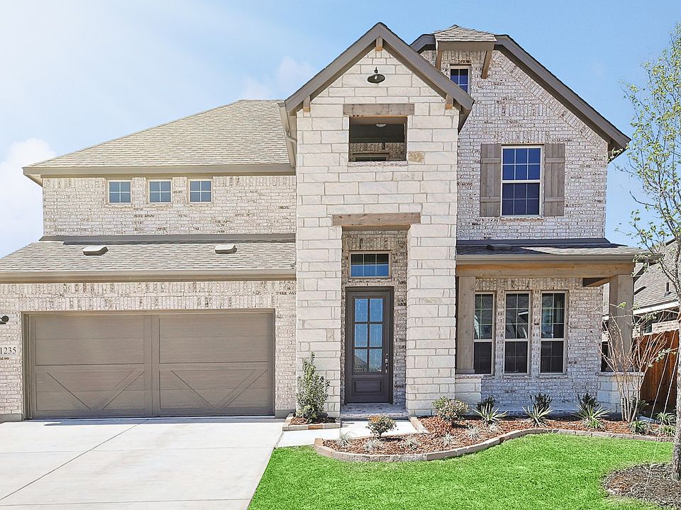 Exquisite brick facade with stone accents and pristine landscaping in Taylor Estates.