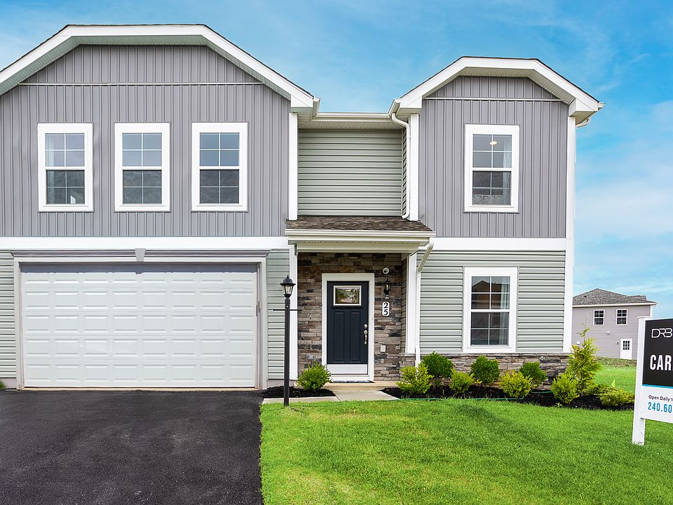 Modern exterior with gray siding, stone accents, and a welcoming covered entry for a timeless curb a