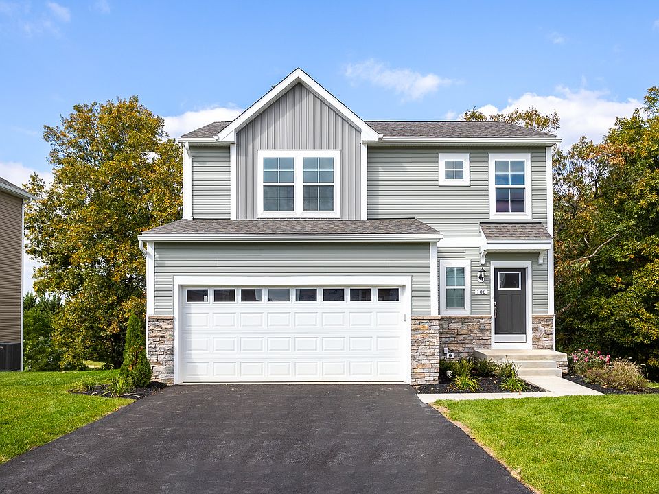 The Glenshaw offers timeless curb appeal with stone accents, a covered entry, and a spacious two-car
