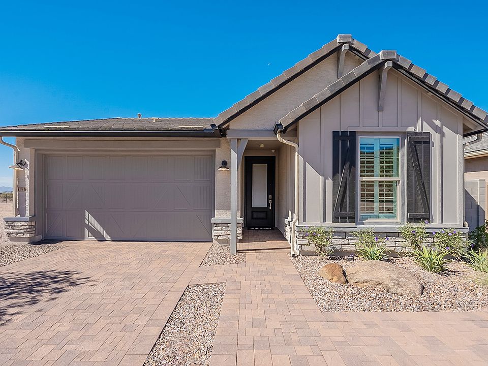 Experience elegant living with stone details and gabled roofing in Vistancia s exclusive Saguaro Hil
